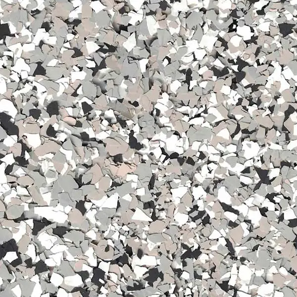 A close-up of a textured, speckled surface featuring random gray, white, and black flecks, resembling a terrazzo or decorative flooring pattern.