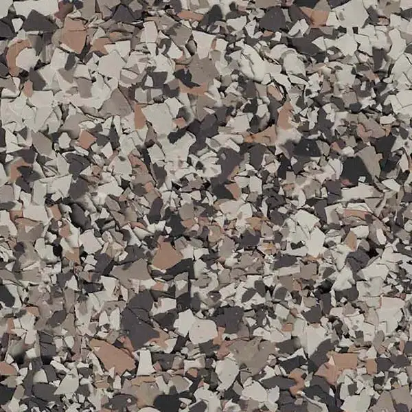 A close-up of a textured surface featuring a blend of gray, beige, brown, and black speckles, creating a mosaic-like appearance.
