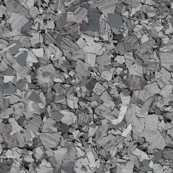 A close-up image of gray stone chips scattered randomly, creating a textured pattern with varying shades and shapes across the surface.