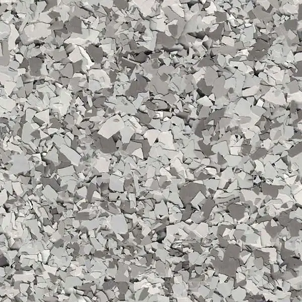 A textured surface composed of broken, irregular, light gray fragments closely packed together, creating a dense pattern with rough, jagged edges throughout.