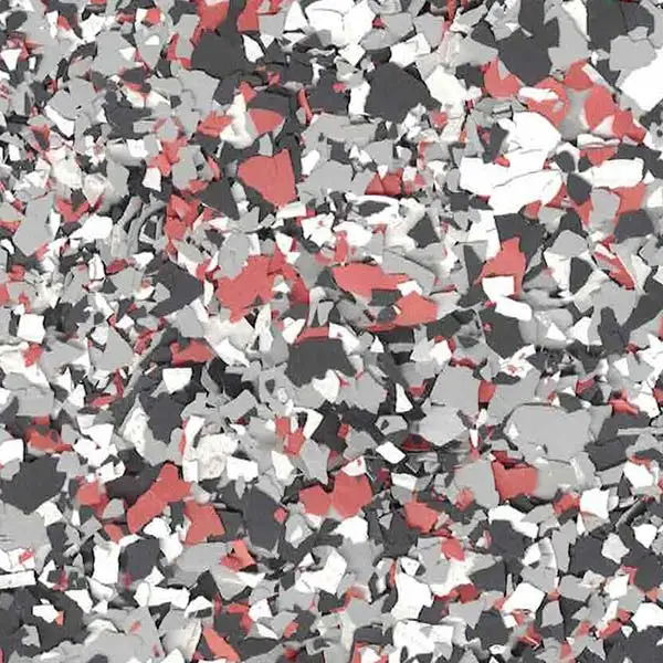 Abstract pattern of scattered, multicolored flakes—red, black, gray, and white—creating a textured, chaotic mosaic with no distinct shapes or landmarks.