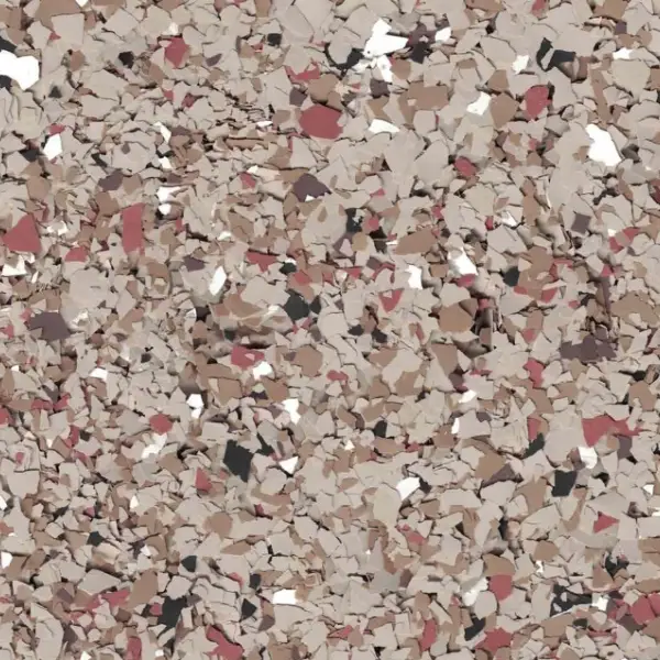 A close-up of a textured surface with an array of small, multicolored flakes in shades of brown, white, red, and black.