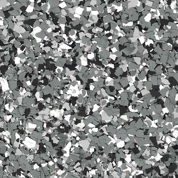 Close-up of a speckled surface with a mix of black, white, and gray flakes resembling a textured, abstract pattern.
