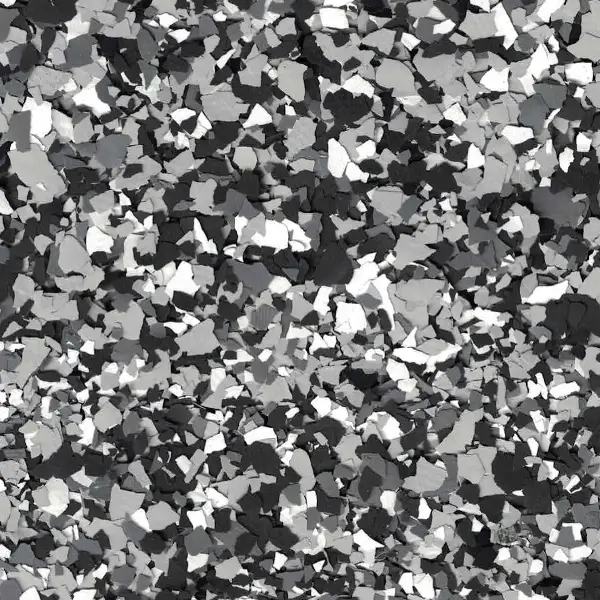 The image shows a pattern of black, gray, and white chipped surfaces resembling terrazzo or mosaic flooring, creating a random, abstract design.